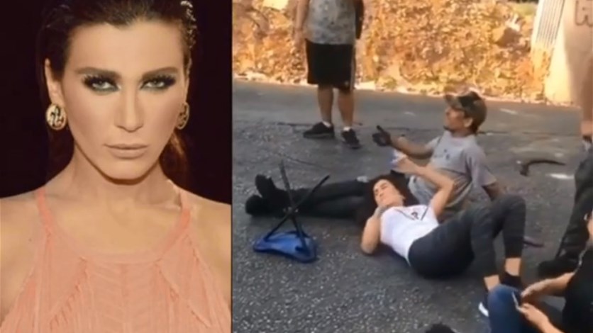 نادين الراسي تقطع الطريق باستلقائها على الأرض: "عيب" (فيديو)