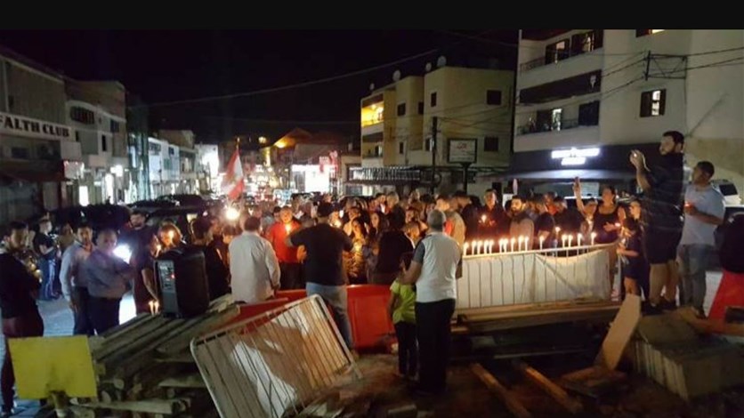 وقفة رمزية في البترون وإضاءة شموع على نية لبنان