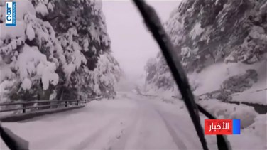Snow cuts roads, traps cars-[REPORT]
