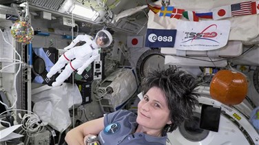 Space station's Italian commander, with lookalike Barbie,...