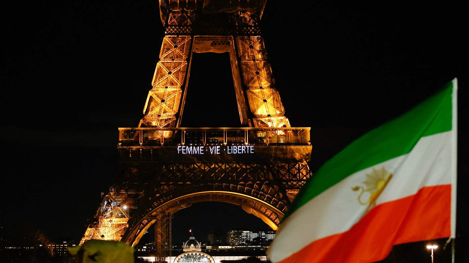 Paris' Eiffel Tower lights up with slogans in solidarity with Iranians
