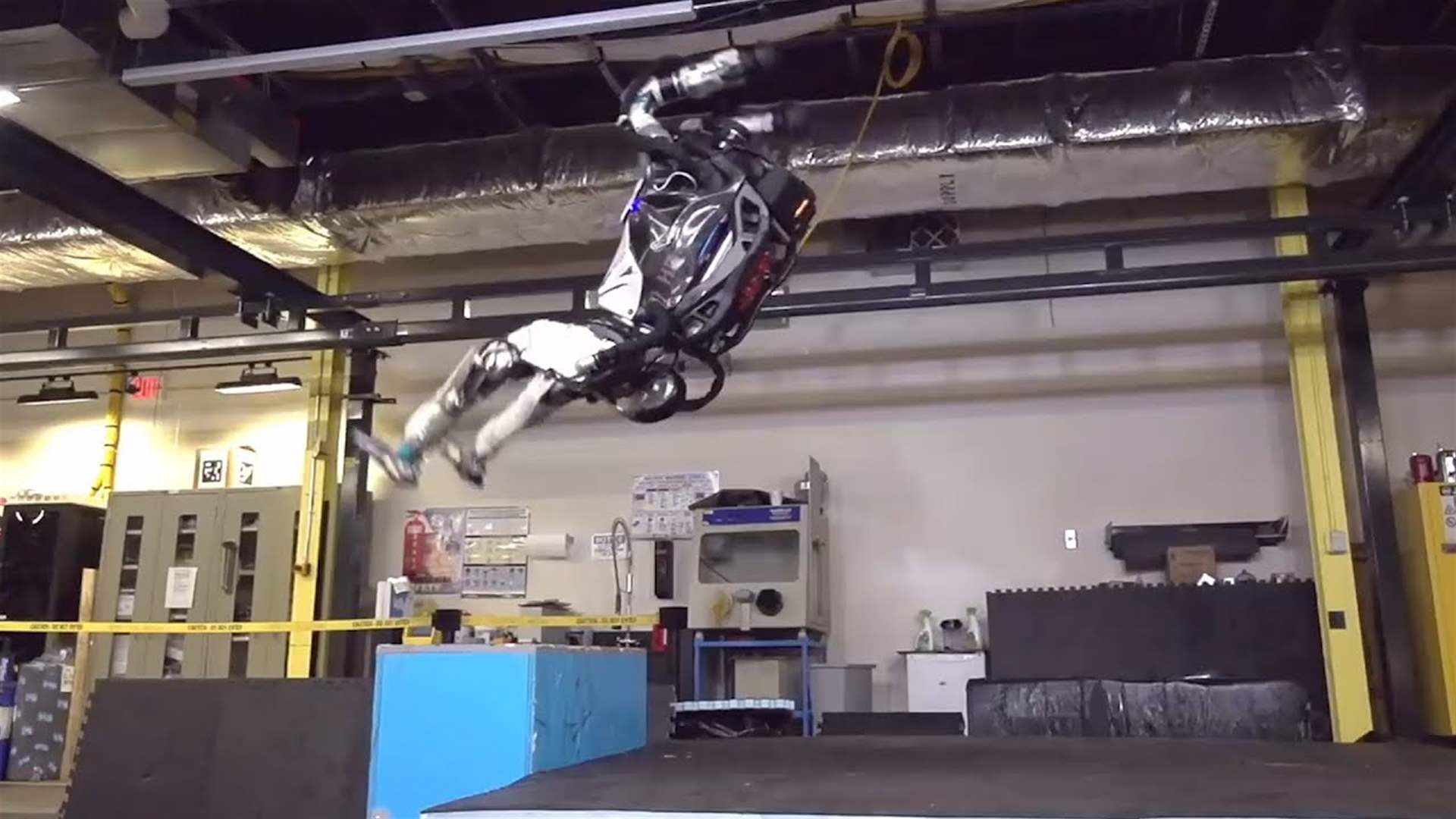 Boston Dynamics’ latest demos show a robot that can run, jump, and now, grab and throw things