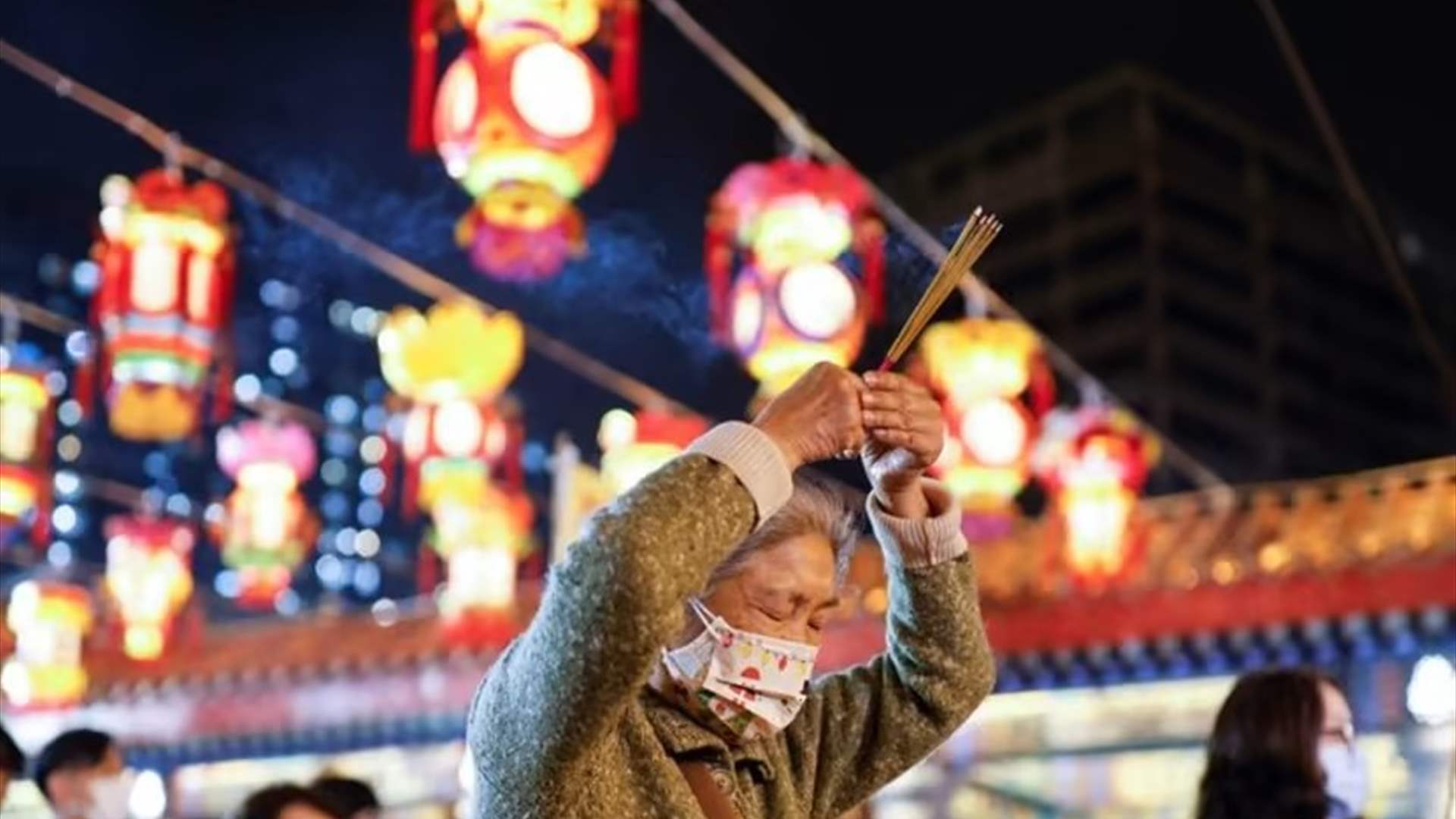 Chinese pray for health in Lunar New Year as COVID death toll rises