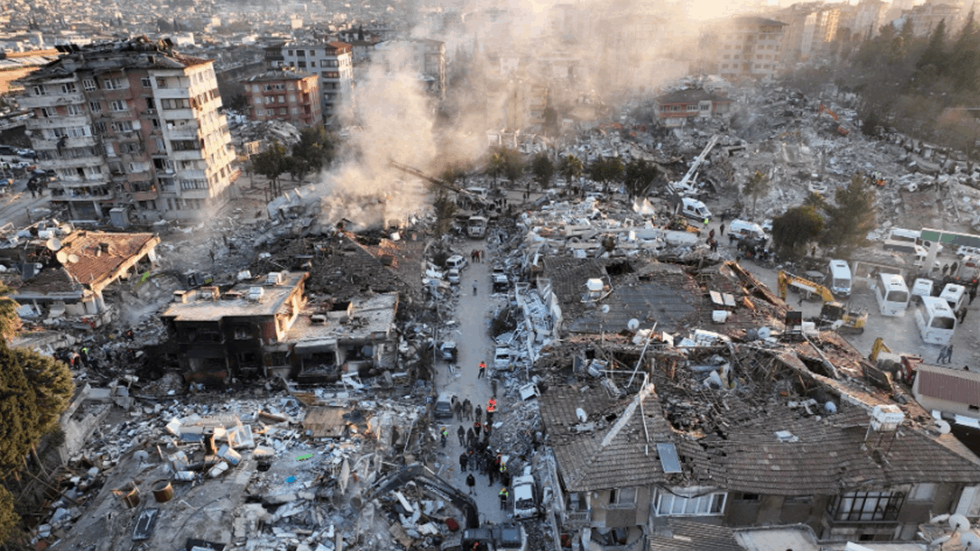 Two women pulled from rubble in Turkey, some aid reaches Syria