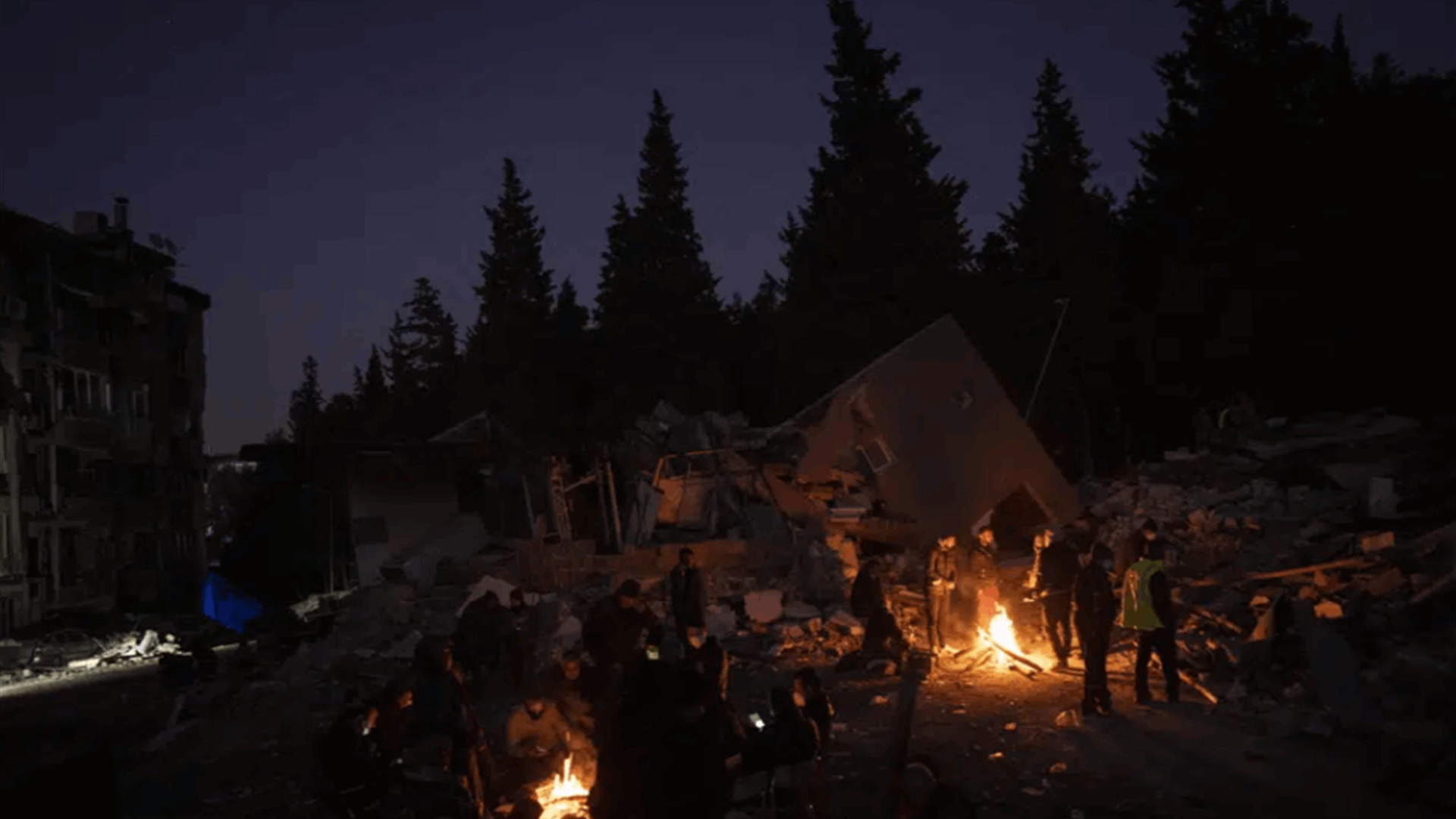 Quake survivors wait amid rubble, to search or say goodbye