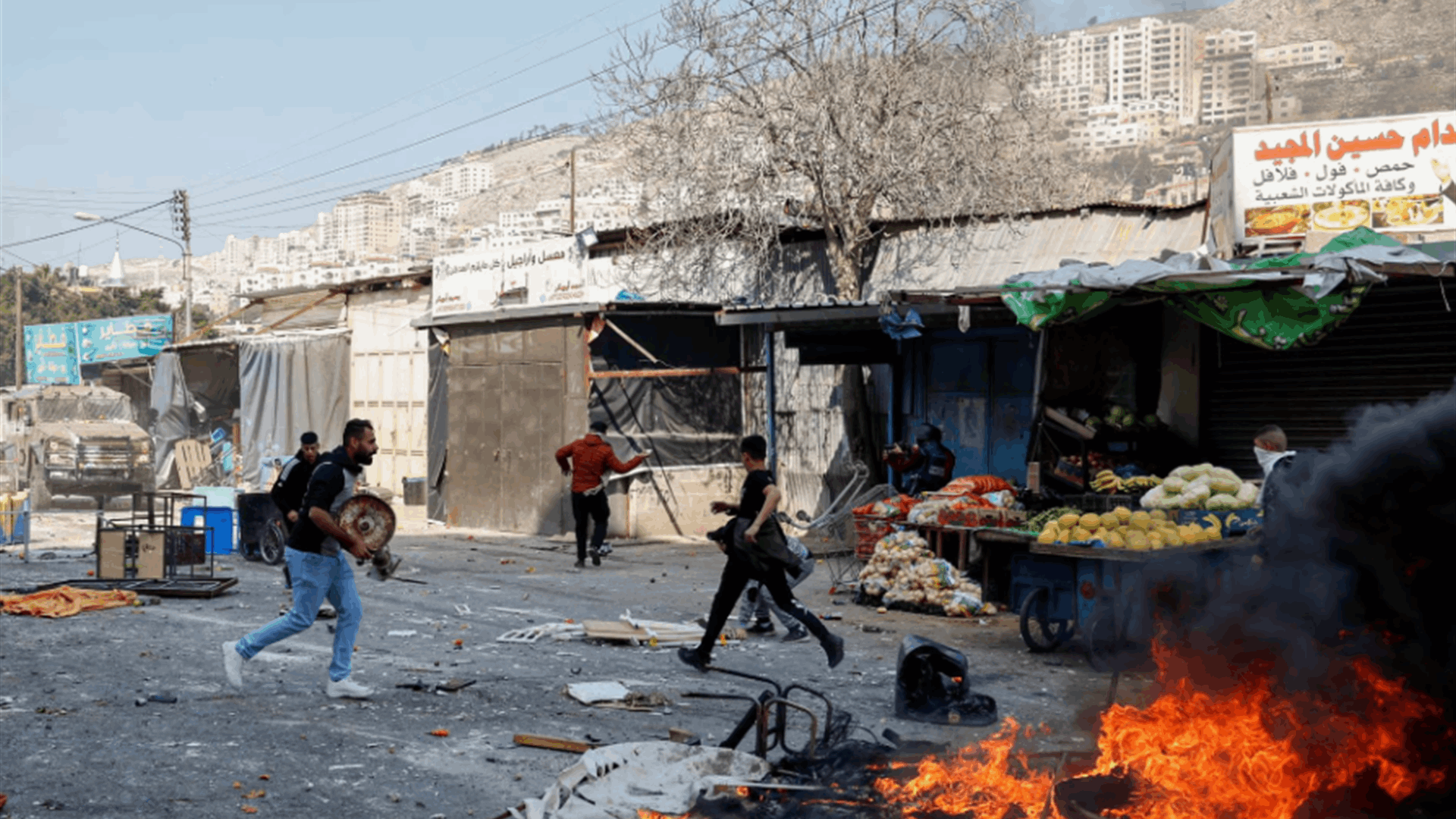 Israeli troops besiege gunmen in West Bank city, two Palestinians killed