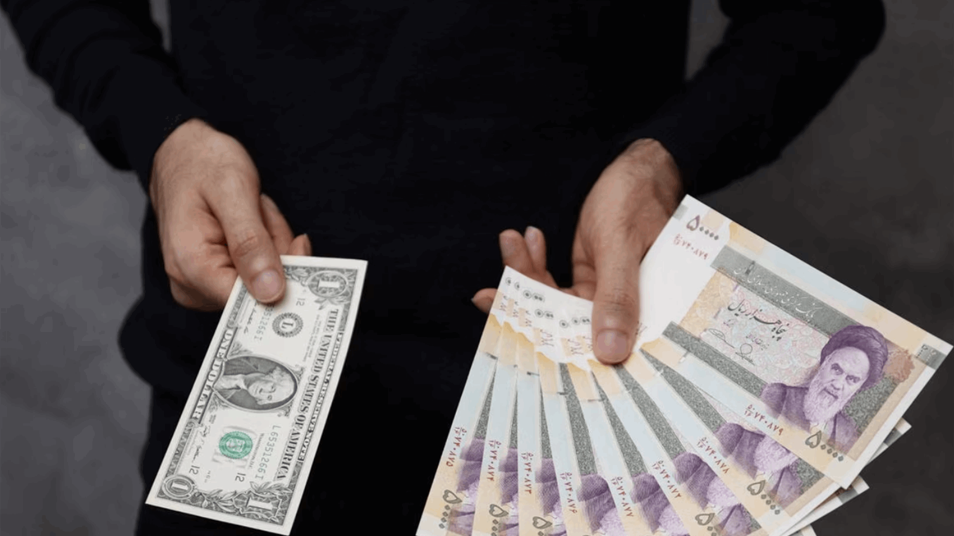 Iran's currency slides to record low as savers buy dollars