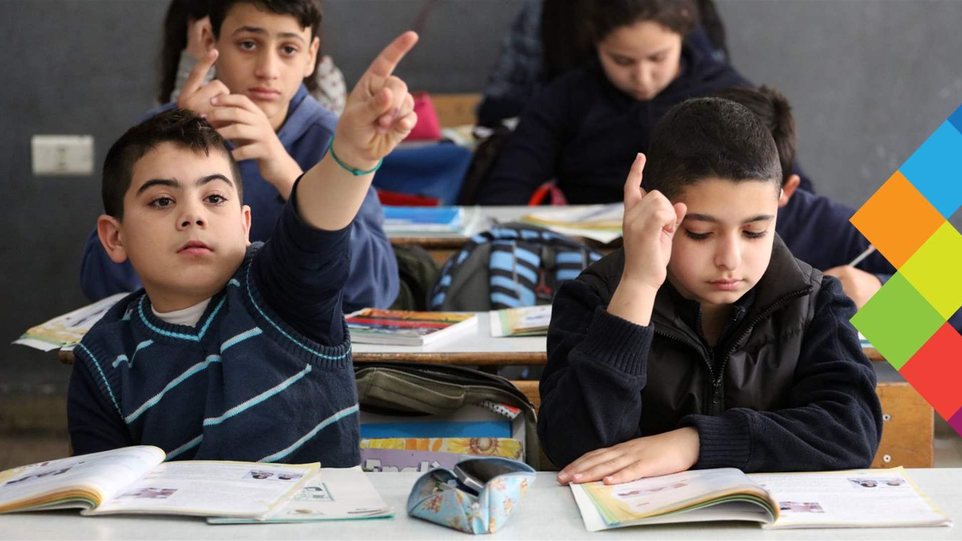 Lebanese students carry outdated textbooks in their backpacks