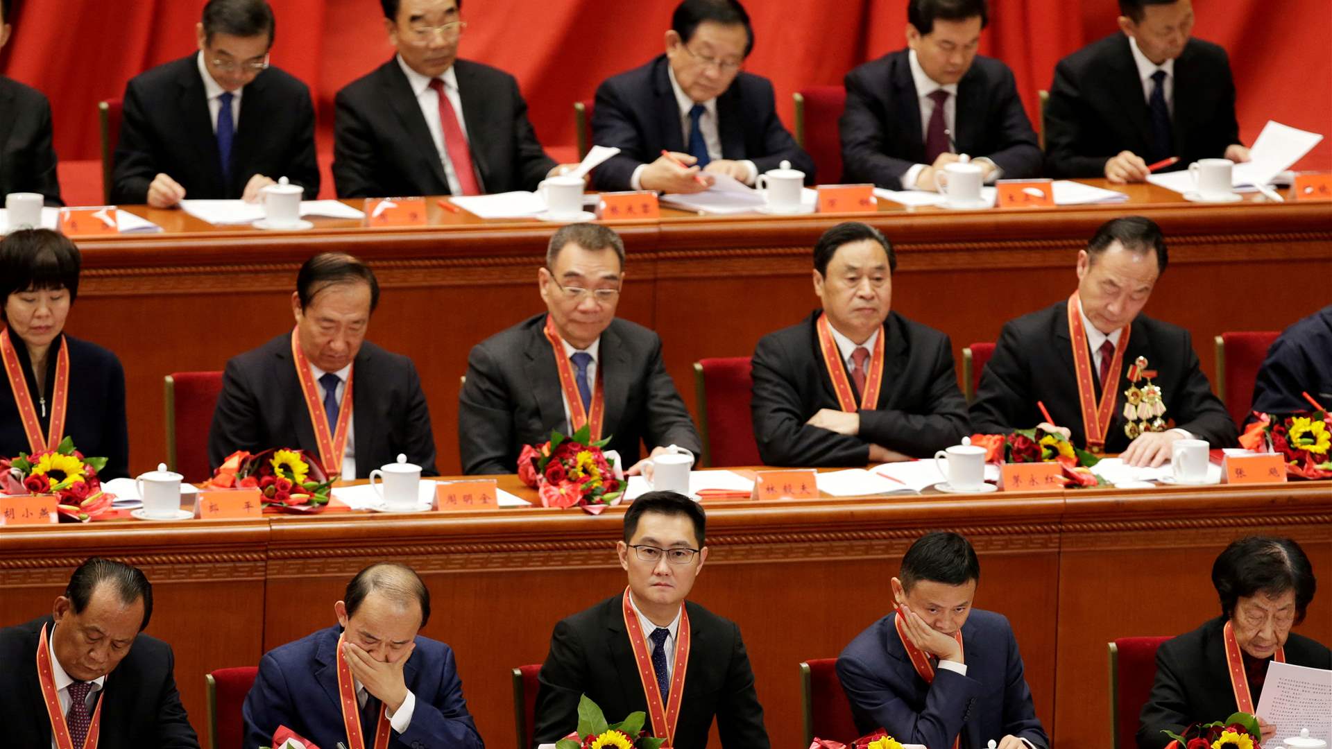 At China political meeting, internet bosses are out, chip execs are in