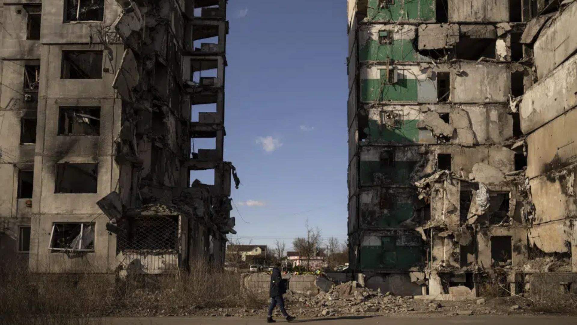 A year into Ukraine war, bodies dug up in once occupied town 