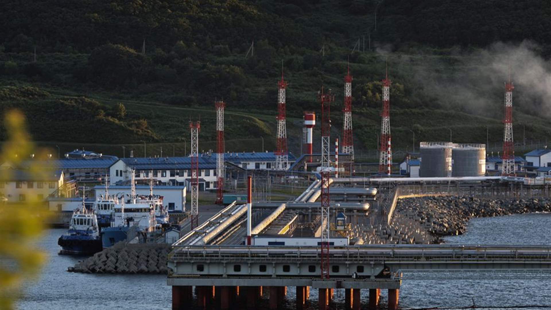 Oil edges lower on stronger dollar and weak Chinese data 