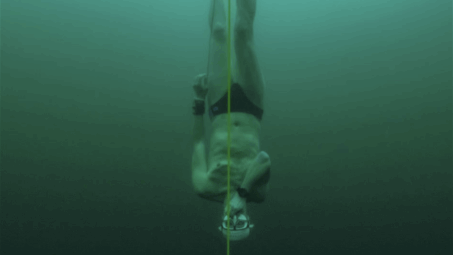 Free-diver plunges to record depth beneath frozen Swiss lake