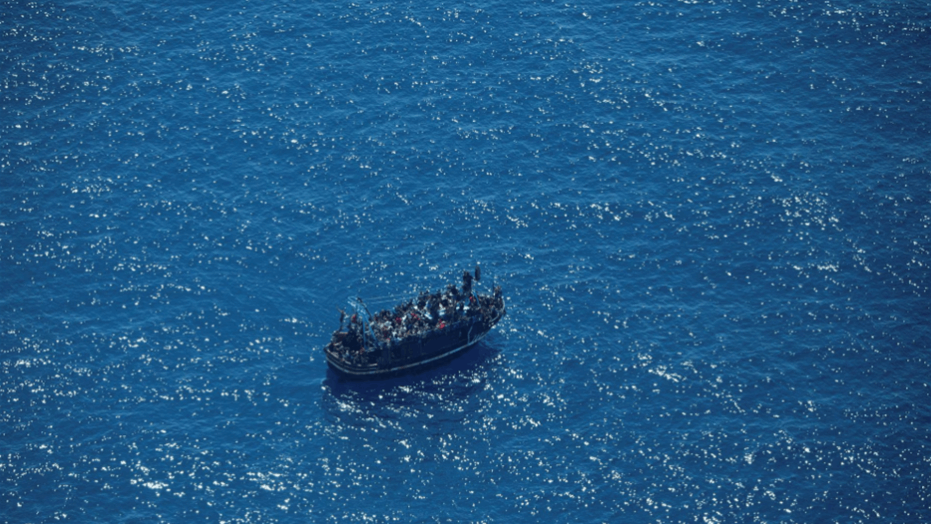 Drifting migrant boat in Mediterranean supplied with fuel but no rescue