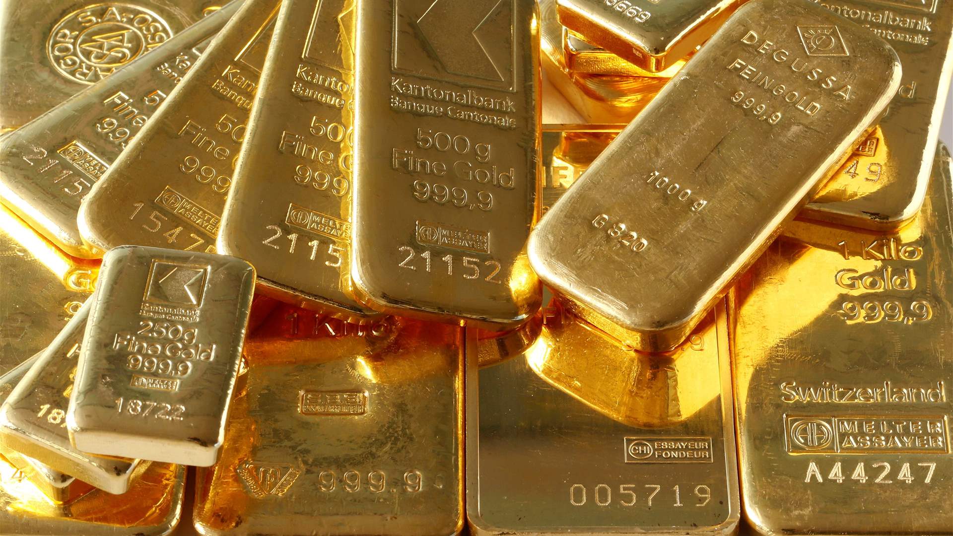 Gold gains on softer dollar as traders await US inflation data