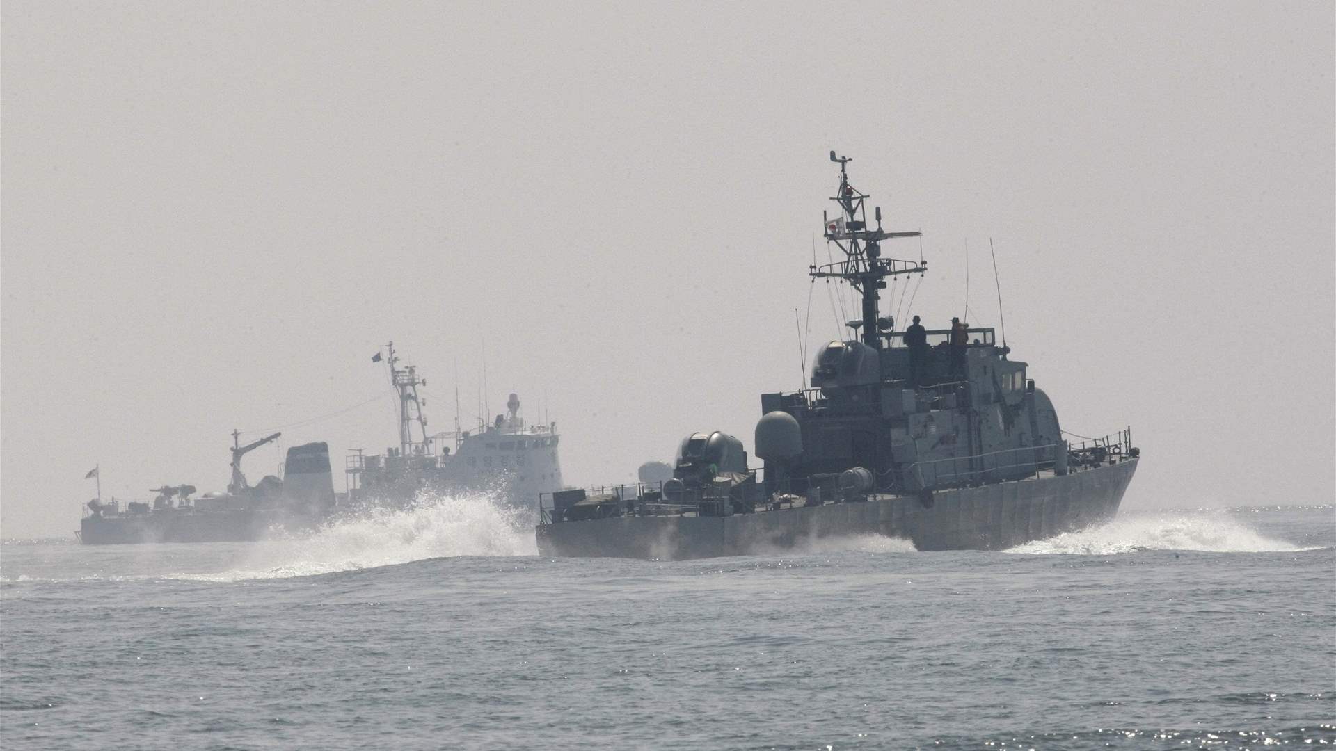 South Korea fires warning shots after North's boat crosses sea border