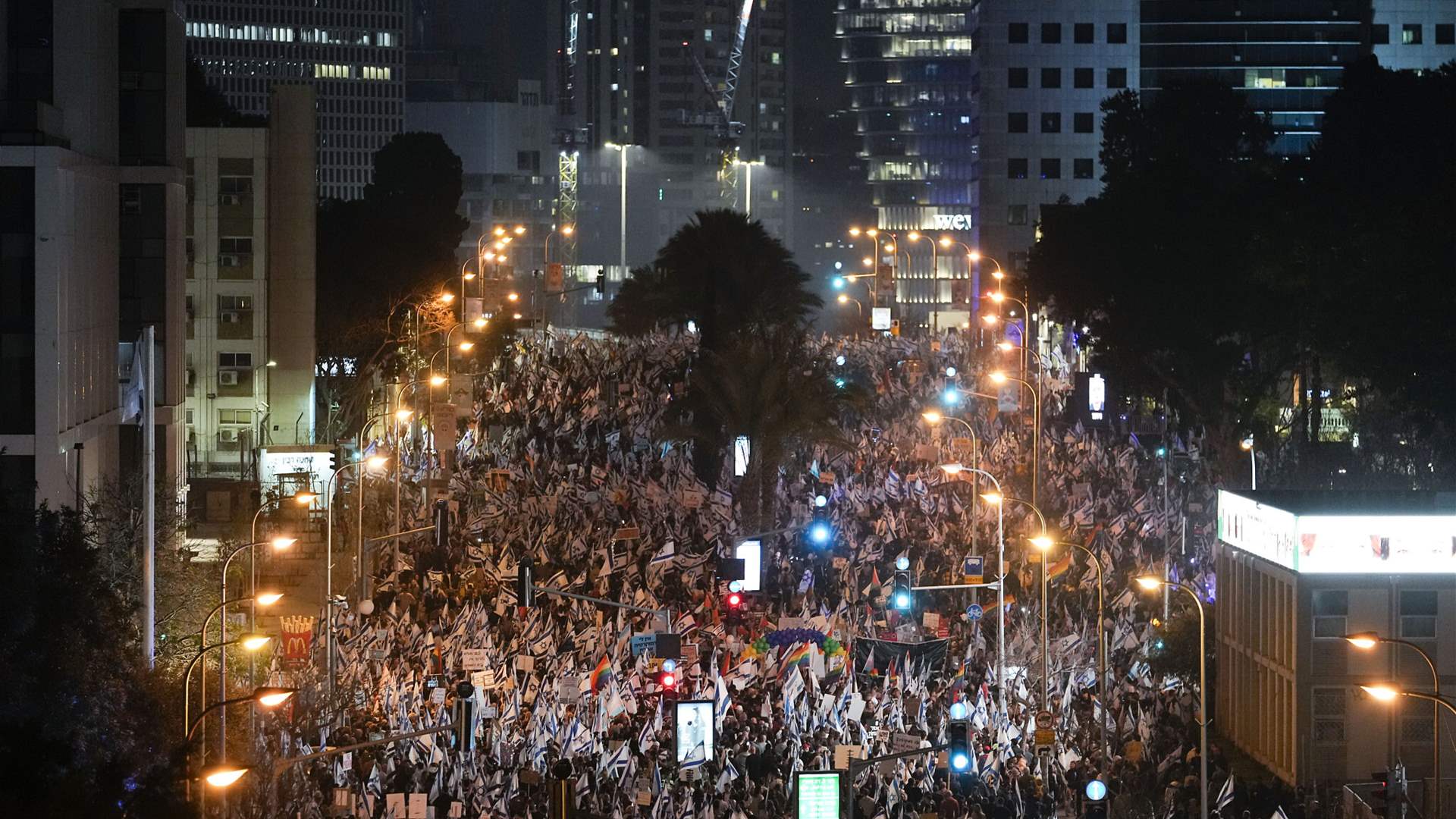 Israeli leaders rebuff Moody's outlook cut, protests persist