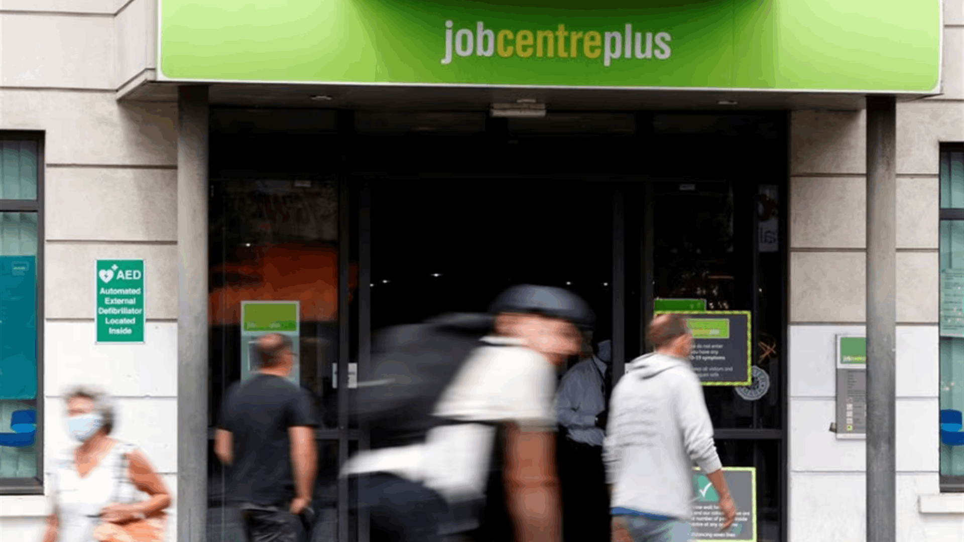UK unemployment edges up but pay growth beats forecasts