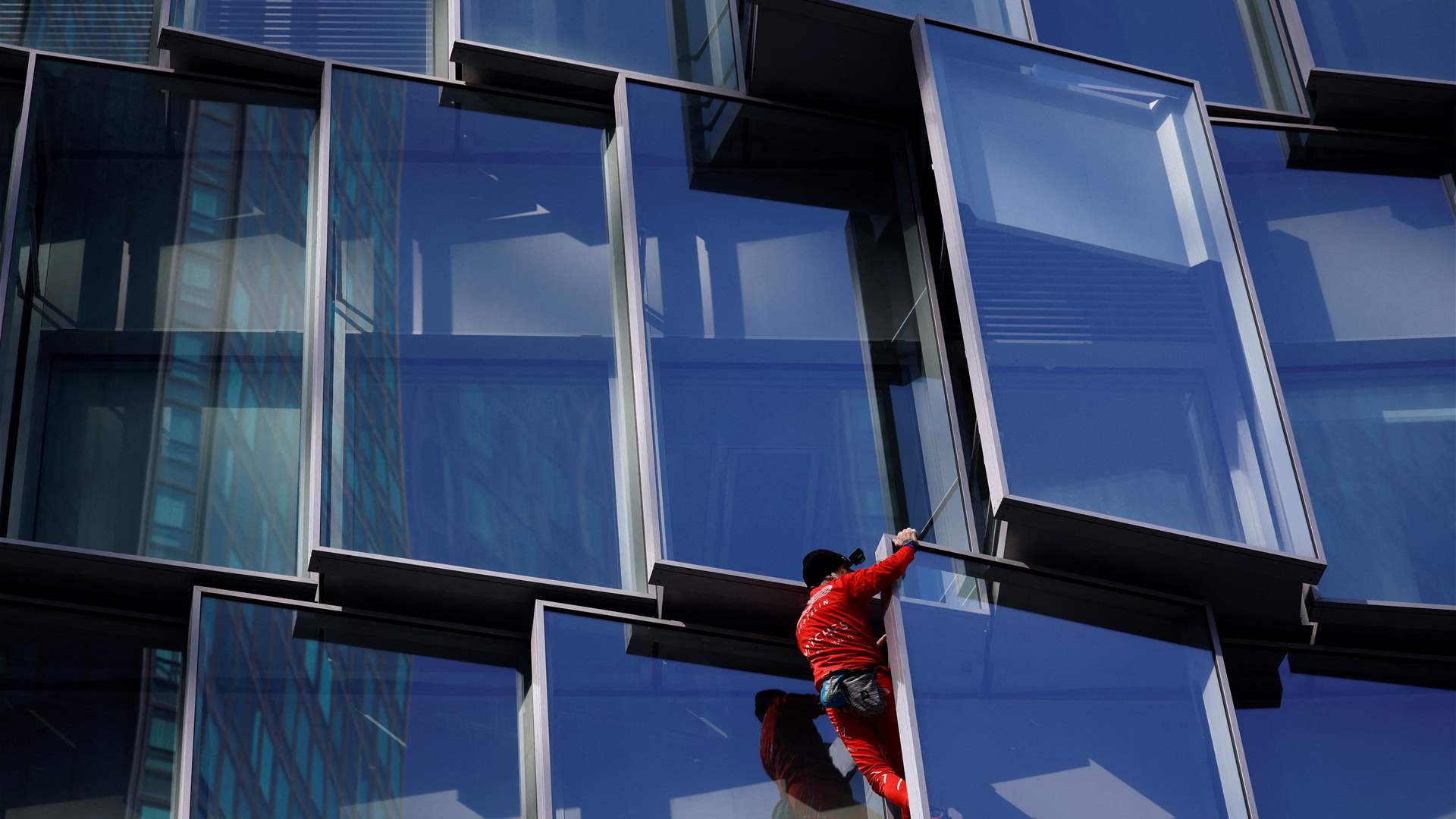 'French Spiderman' climbs Paris skyscraper as protest against pension law