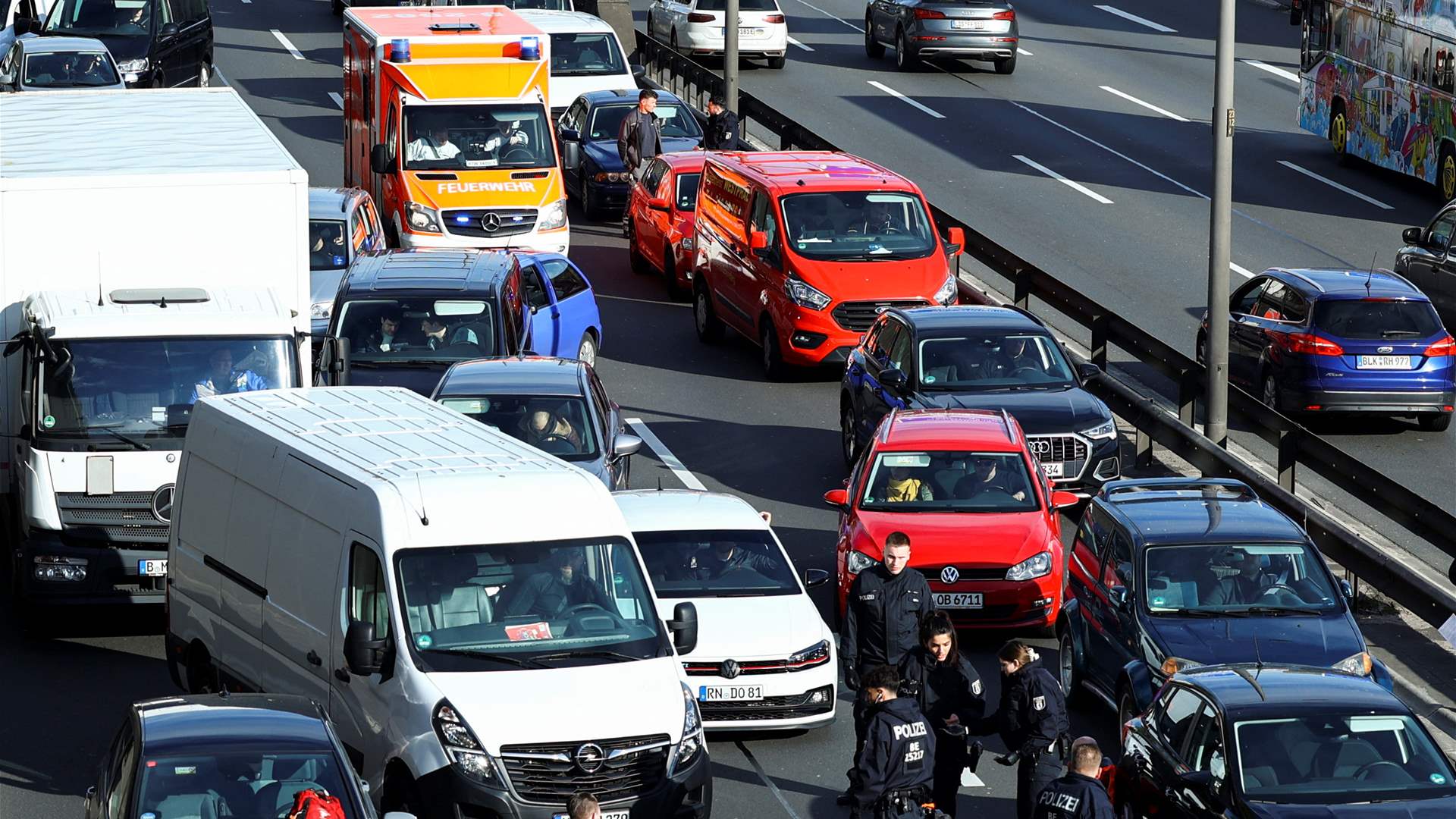  Tempers fray as climate activists glue themselves to roads in Berlin