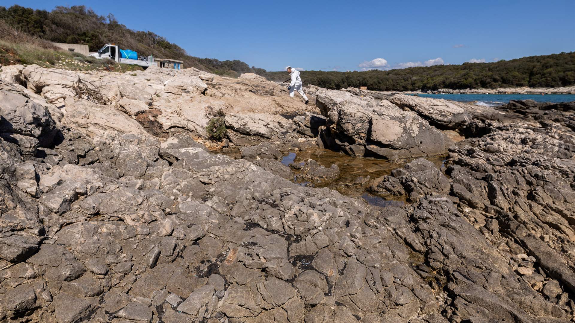 Croatia clears mystery clumps of oil from beaches before tourists arrive