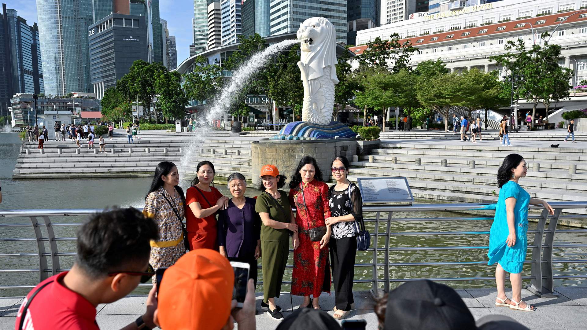 After opening borders, China presses Singapore for visa-free travel deal