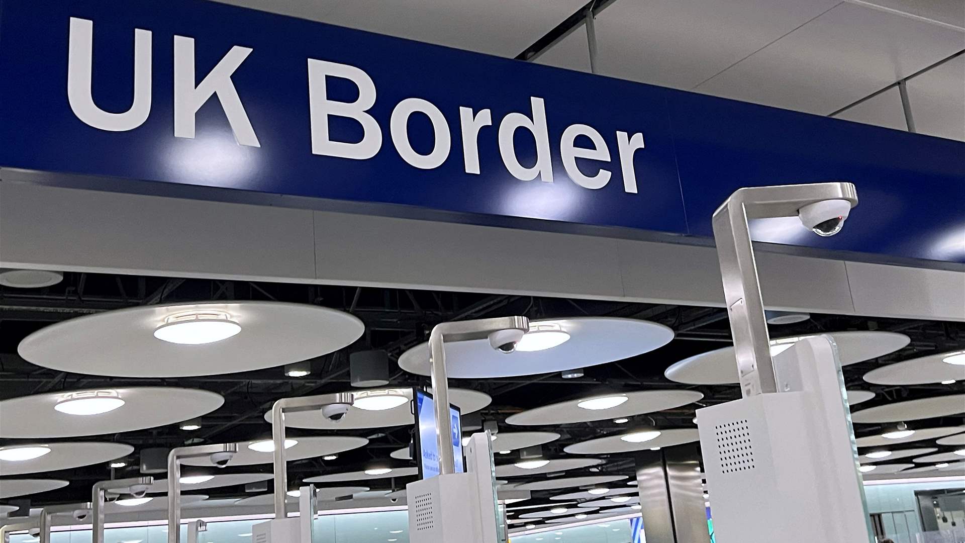 Britain says border e-gates back in service after outage sparked delays