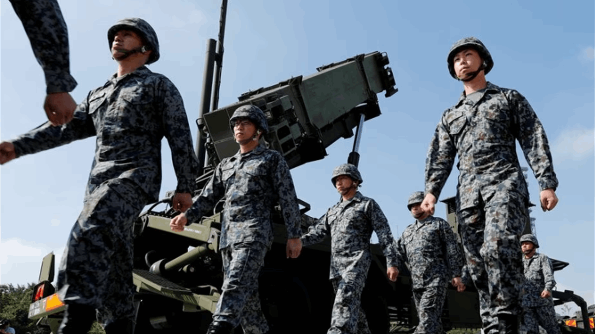 Japan puts missile defense on alert as N.Korea warns of satellite launch