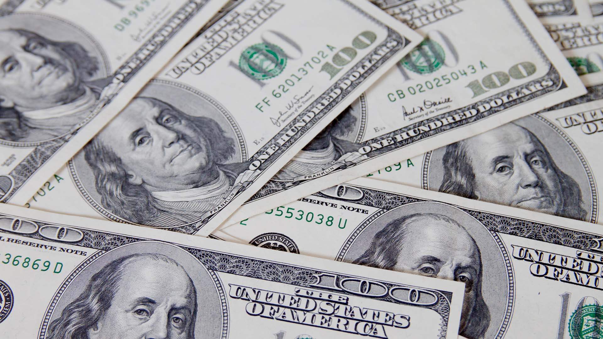 Stocks advance, dollar down as markets focus on rate calls