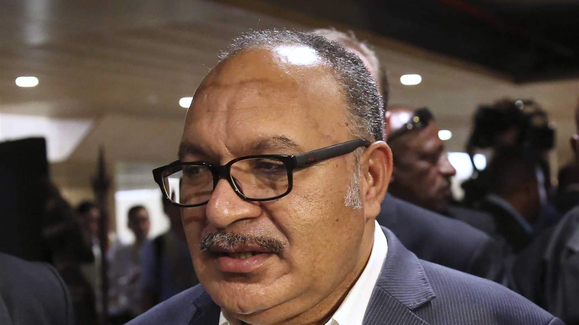 Former PNG leader arrested over UBS loan inquiry