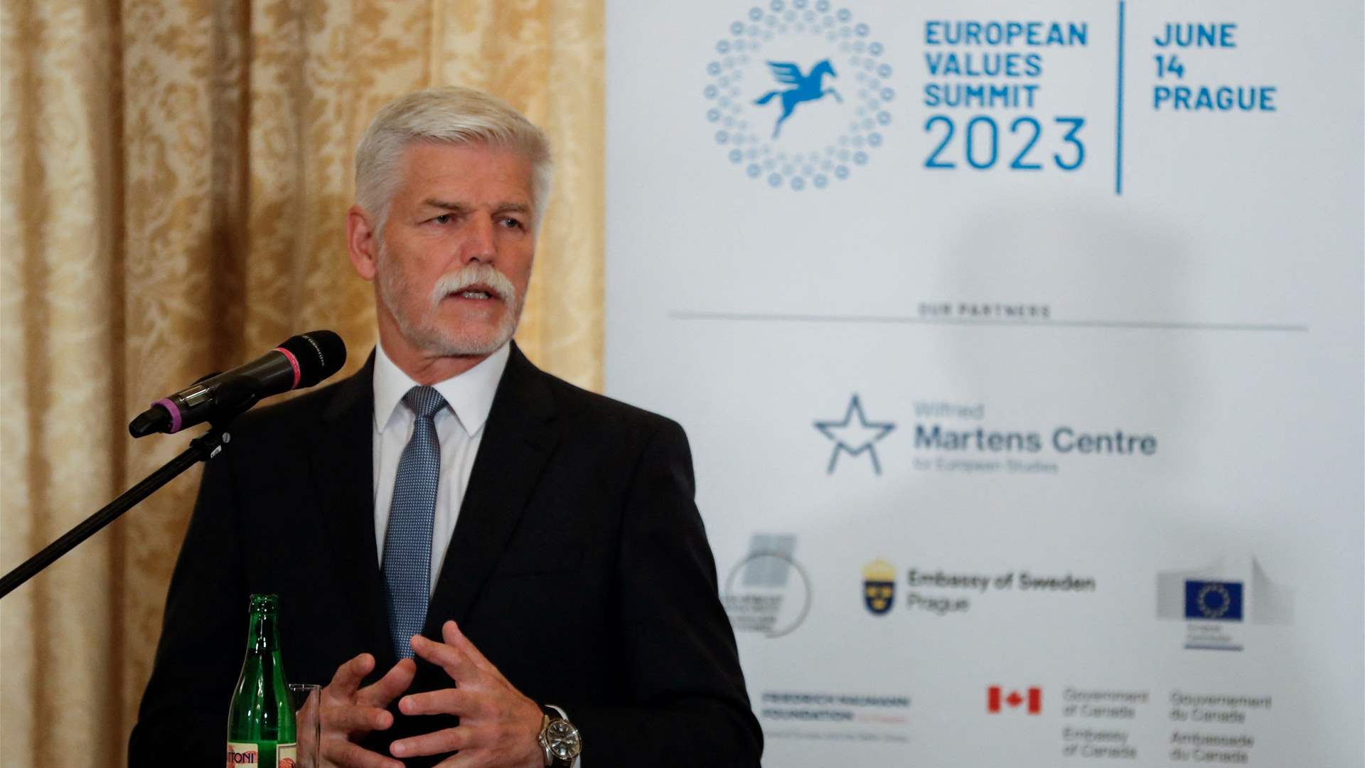 Czech leader waters down remark on keeping tabs on Russians