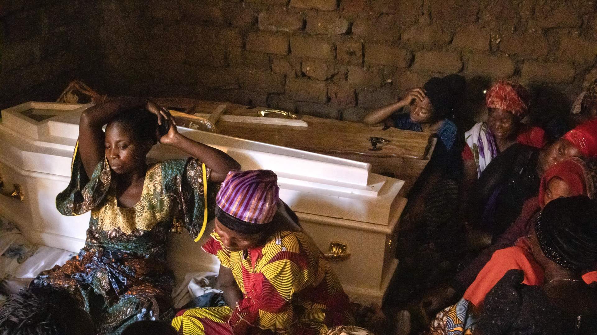 Uganda arrests 20 'collaborators' over horrific school massacre
