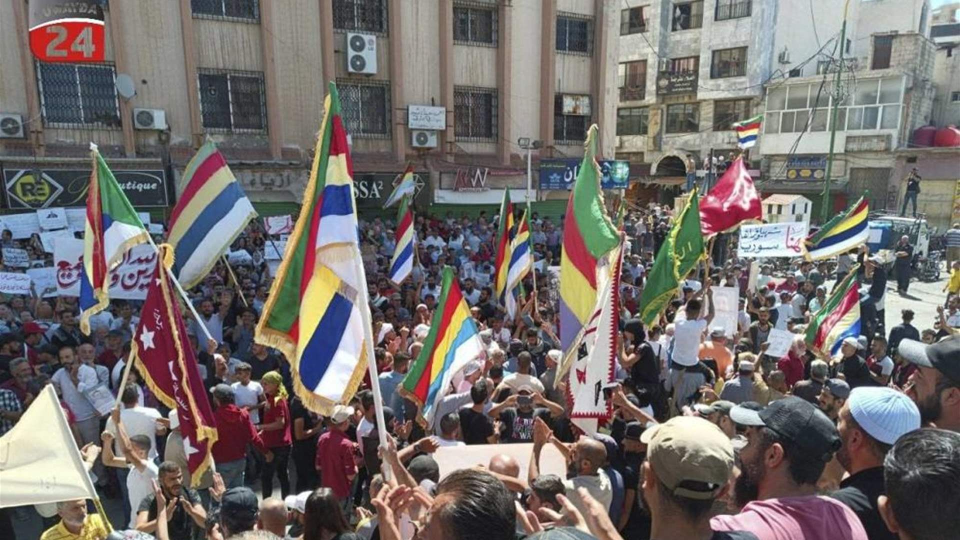 Three people injured in a shooting directed at protesters in the Syrian city of Sweida 