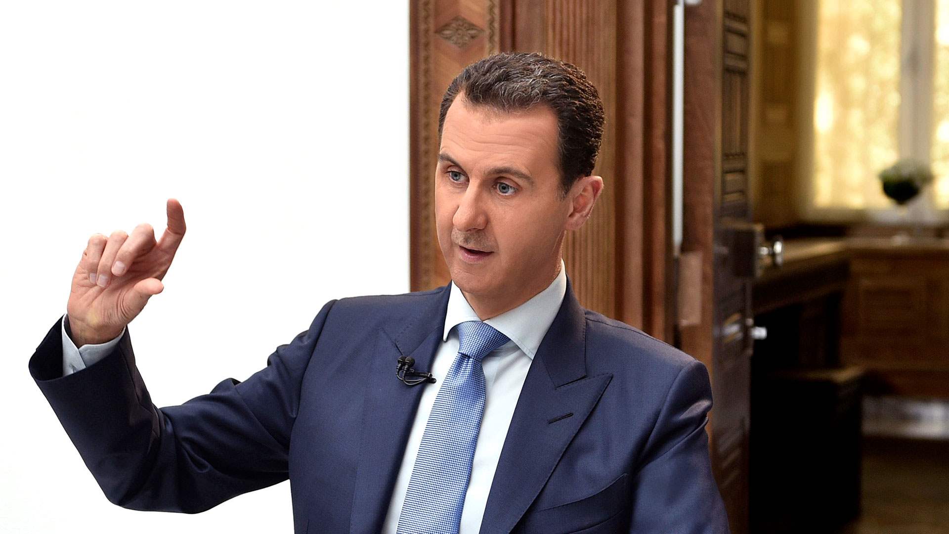 Syrian President Al-Assad says war in Syria is not over