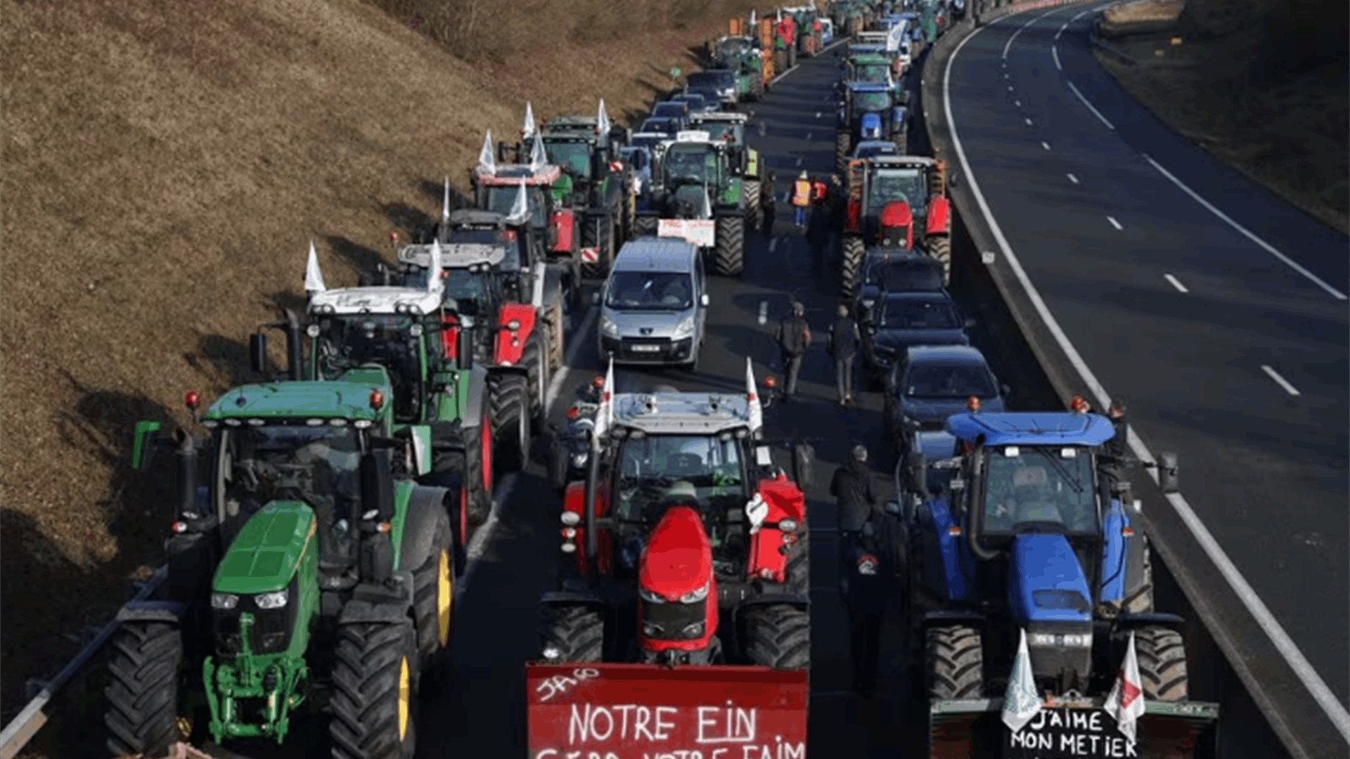 Angry French farmers block highways in bid to step up pressure on government