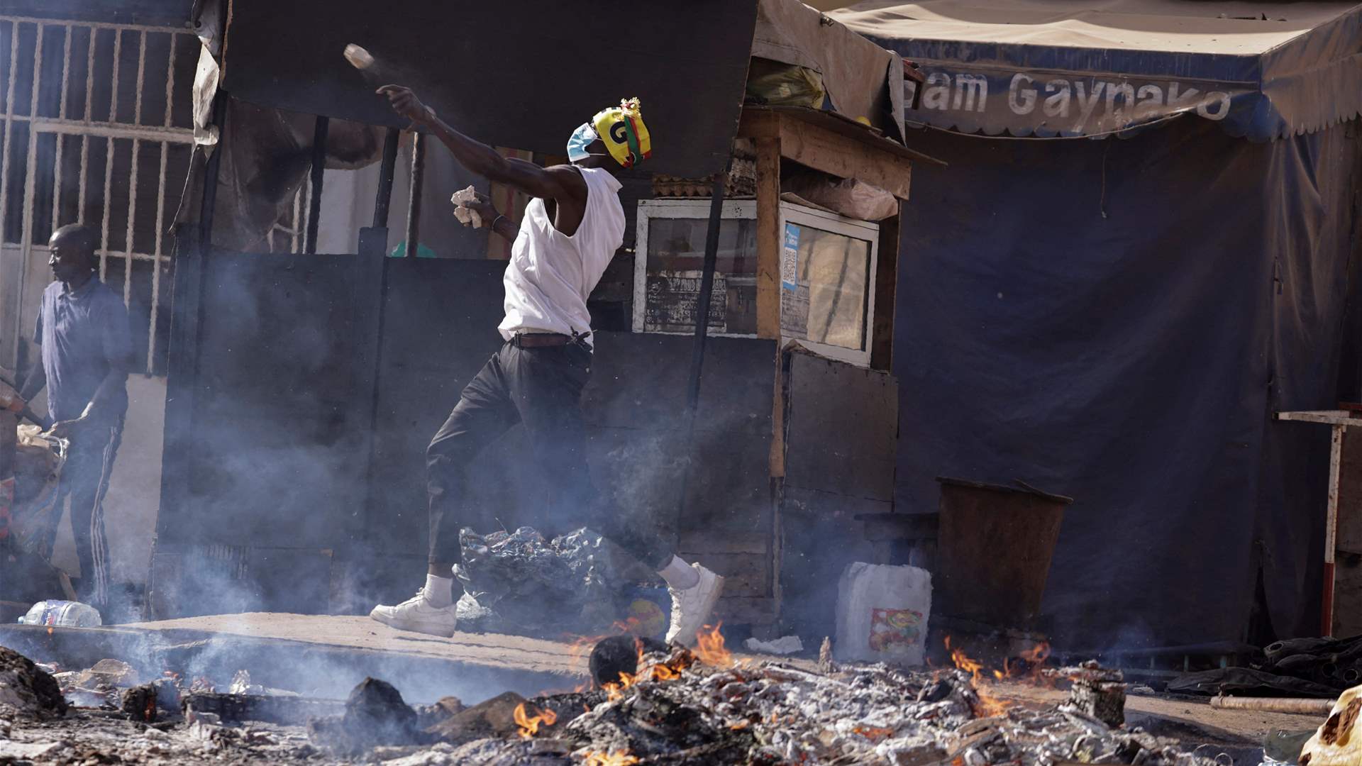 Police and protesters clash after Senegal election postponed