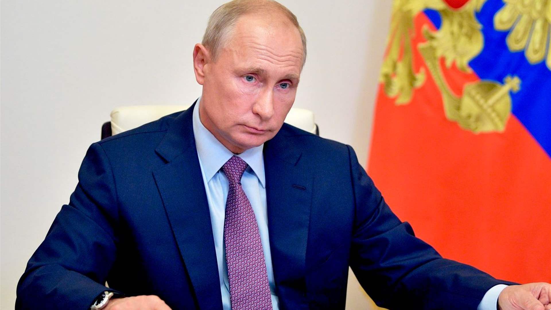 Putin calls on Russians to show &#39;patriotism&#39; through voting in presidential elections