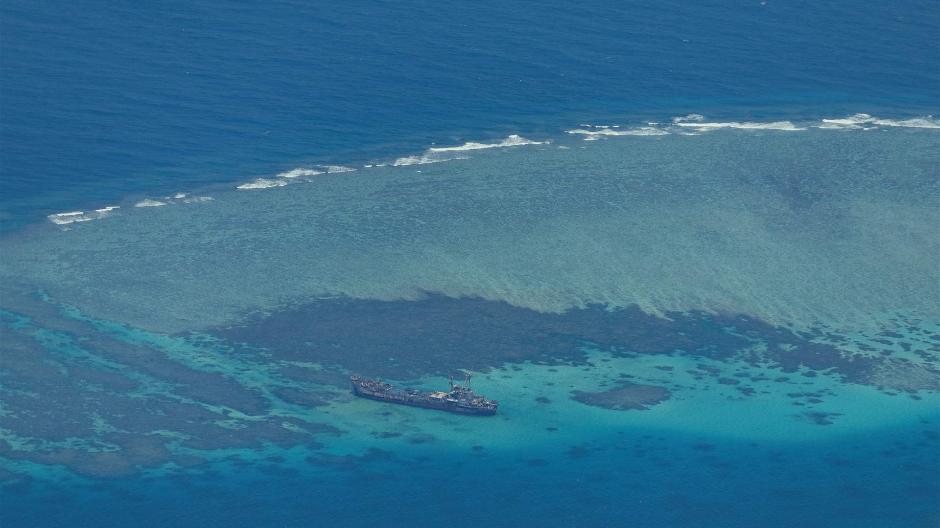 Philippines summons China envoy over standoff, dares Beijing to seek arbitration