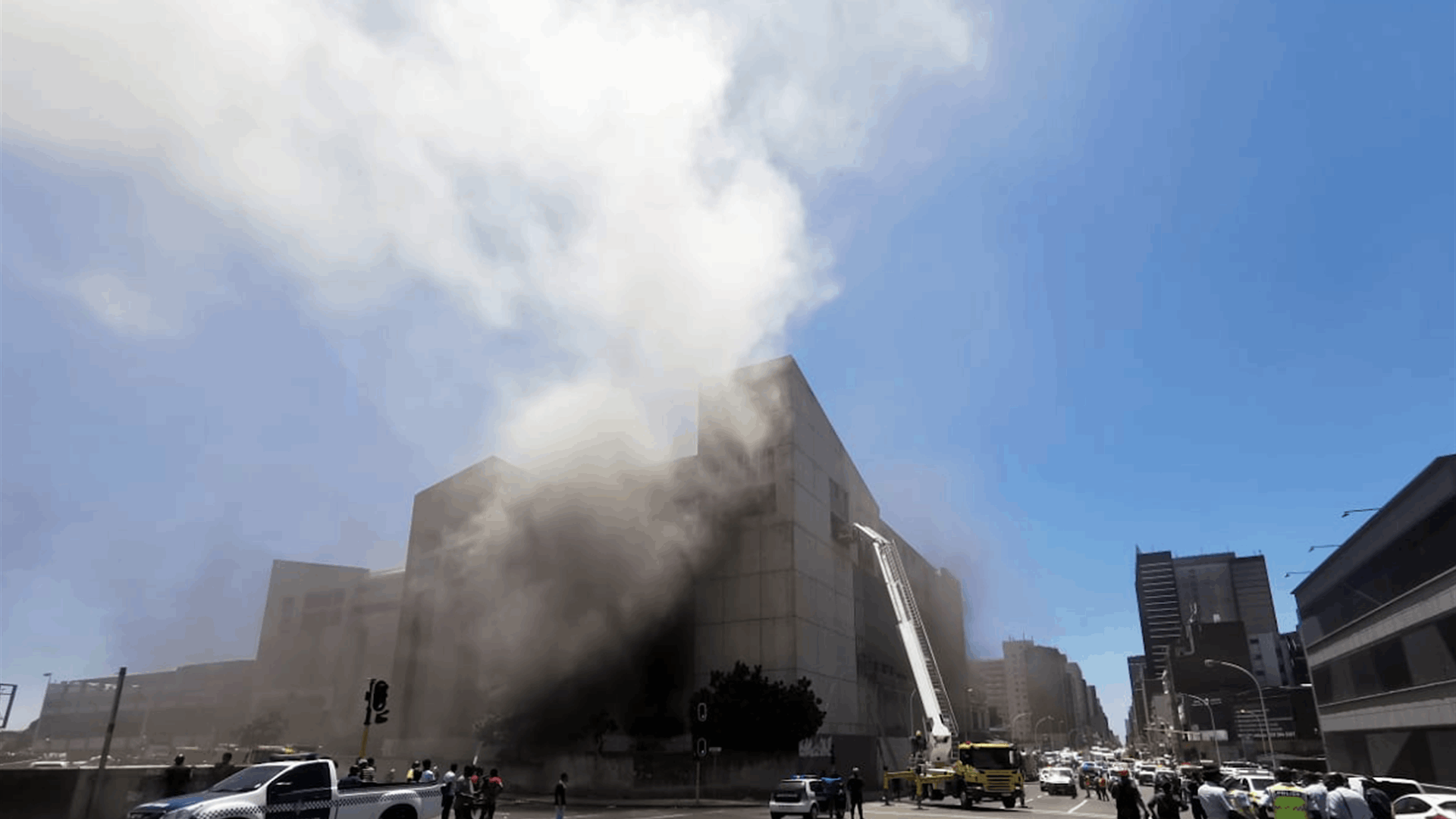 Fire breaks out in China shopping center with people trapped inside