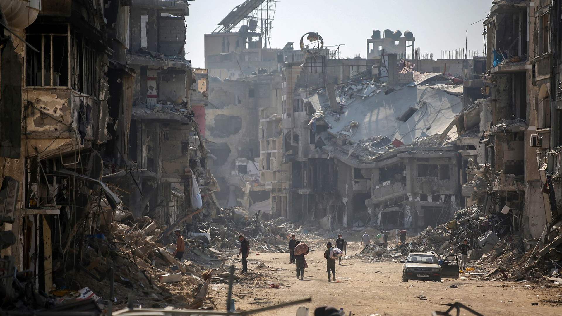 Israeli forces quit east Khan Younis, Palestinians recover dozens of bodies