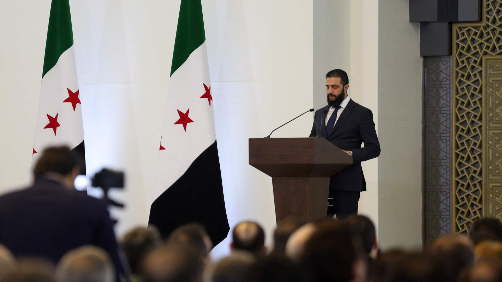 Syria&#39;s interim president names new government dominated by allies