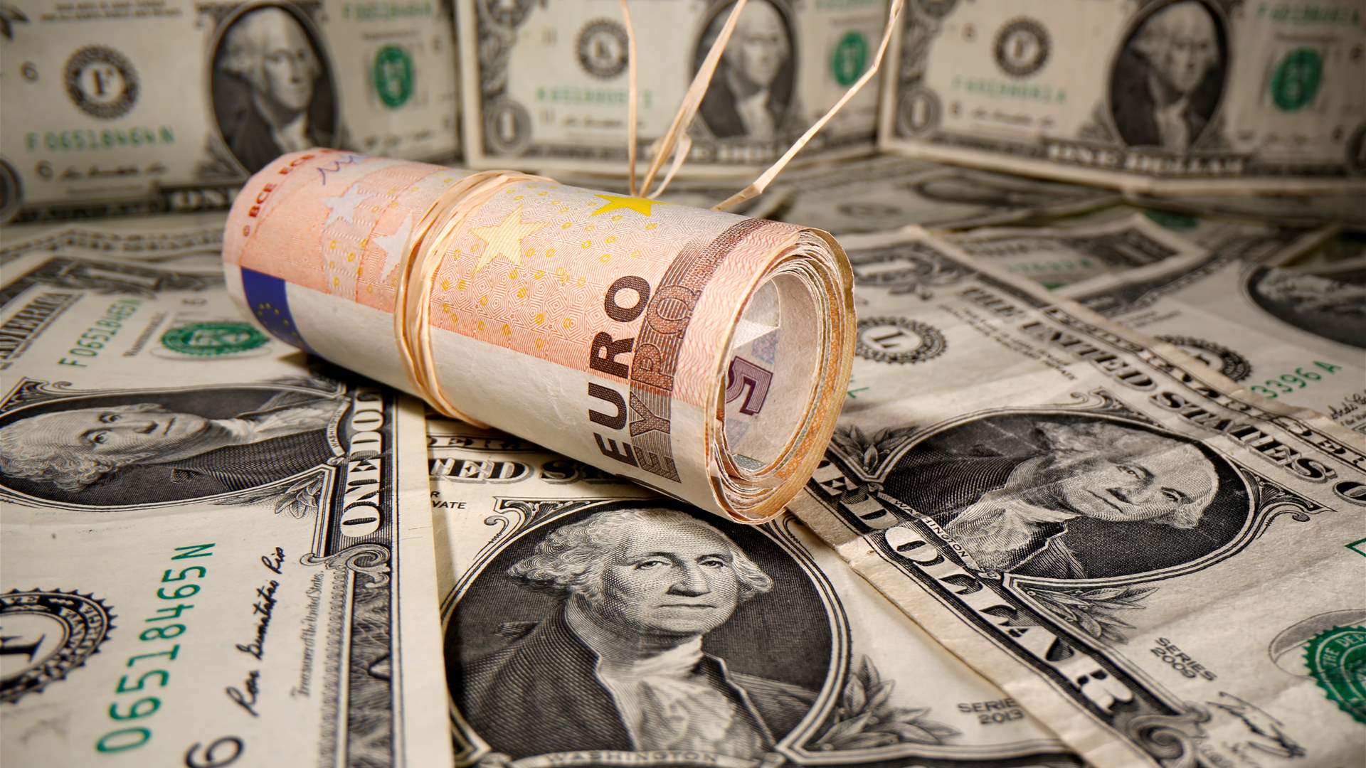 Dollar hits more than three-year low against euro on trade war panic