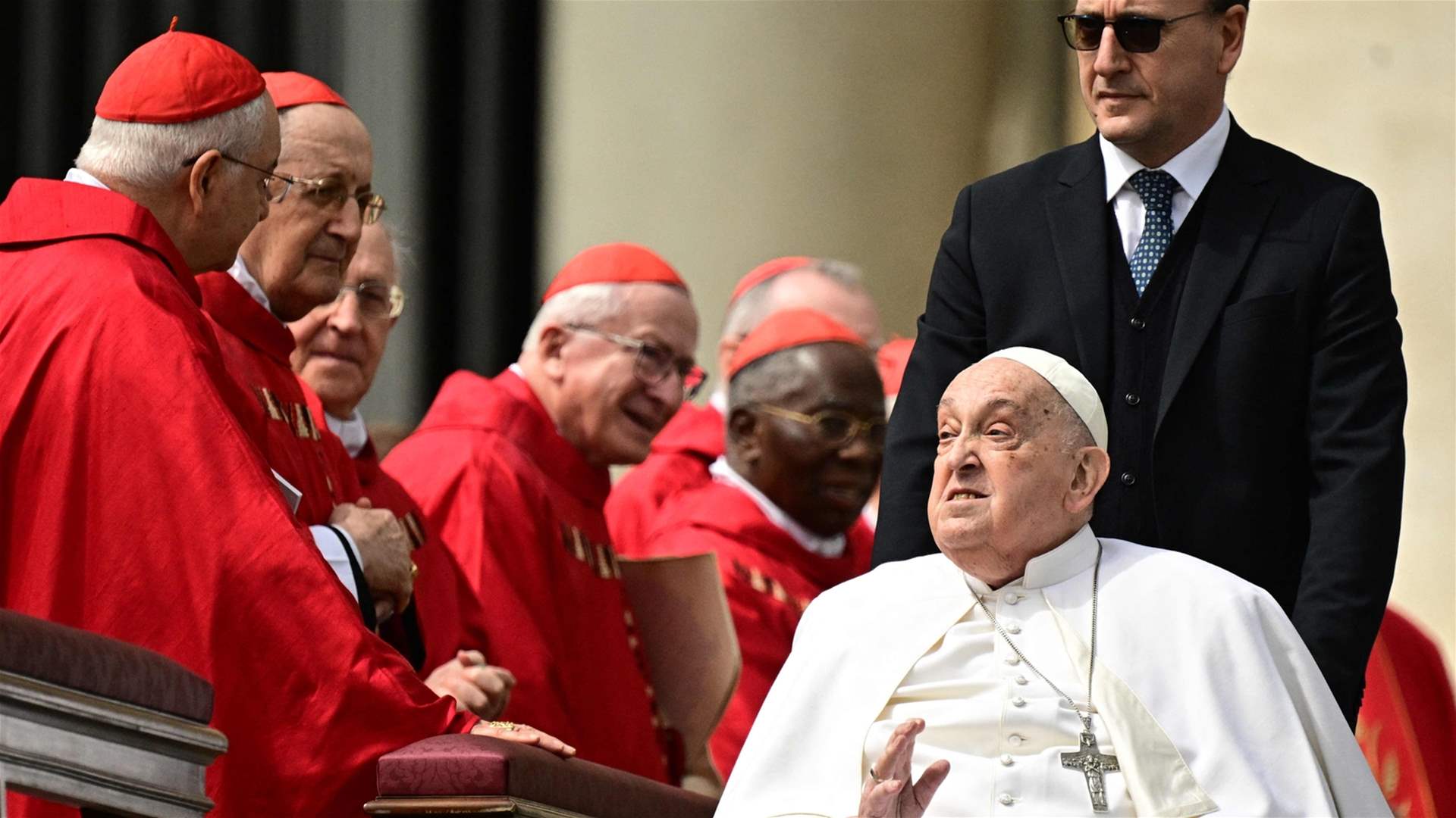Pope Francis makes a brief appearance after Palm Sunday service