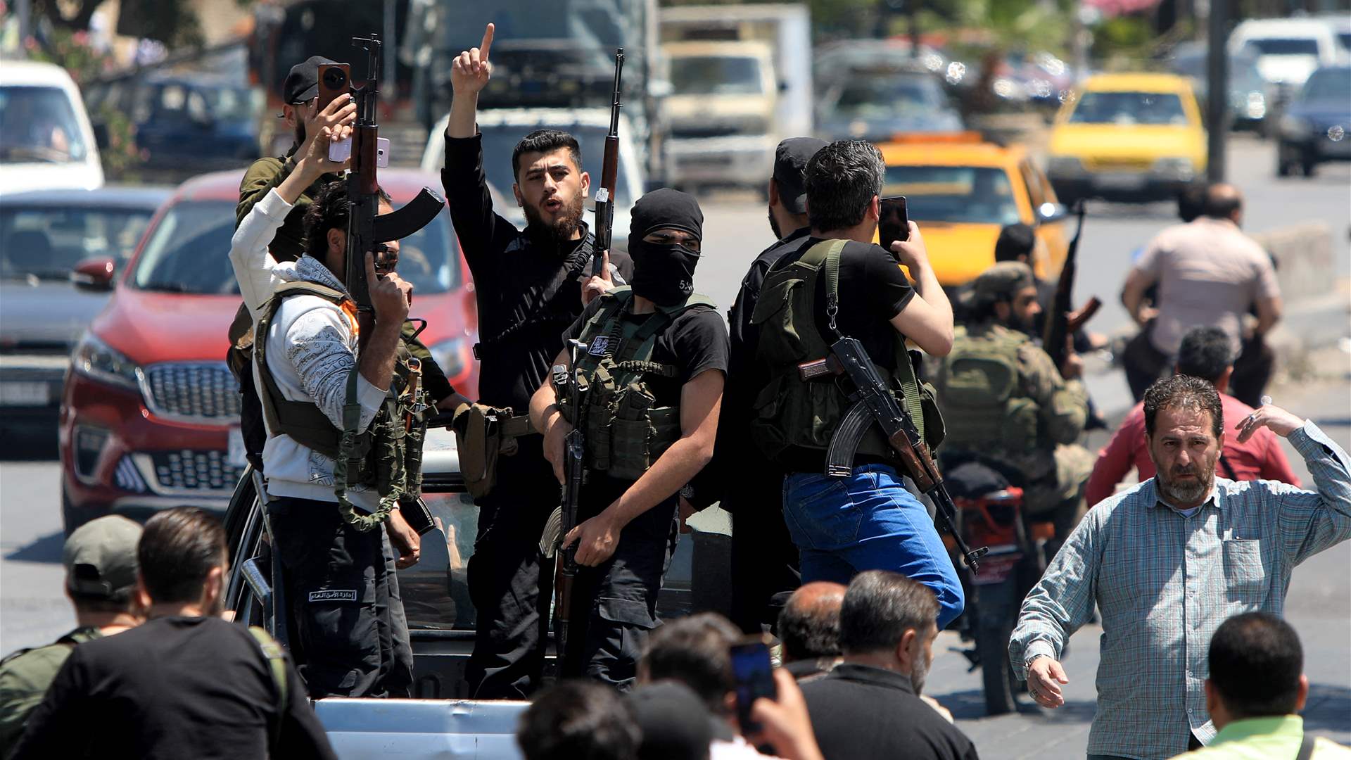 Syria monitor raises sectarian clashes toll to 14 dead