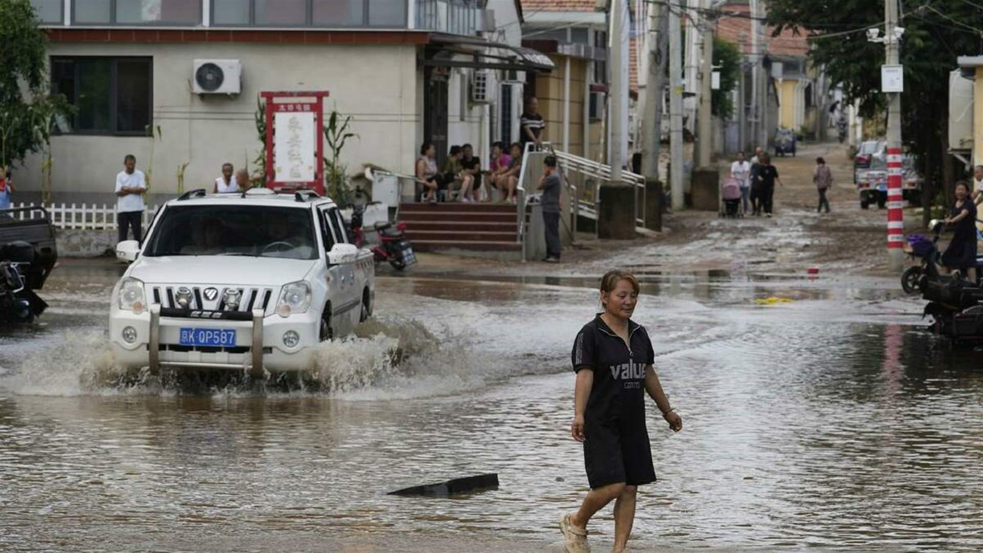 Beijing evacuates residents, expands storm alert as deadly floods keep city on edge
