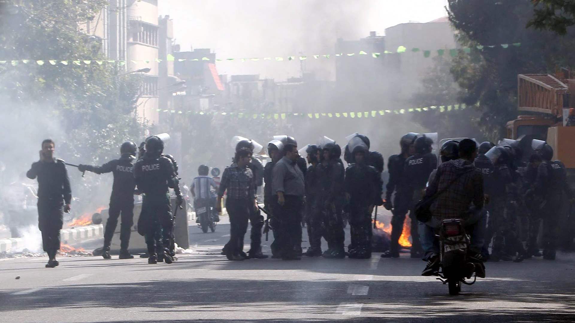 Iran police officer killed in stabbing during unrest near Tehran 