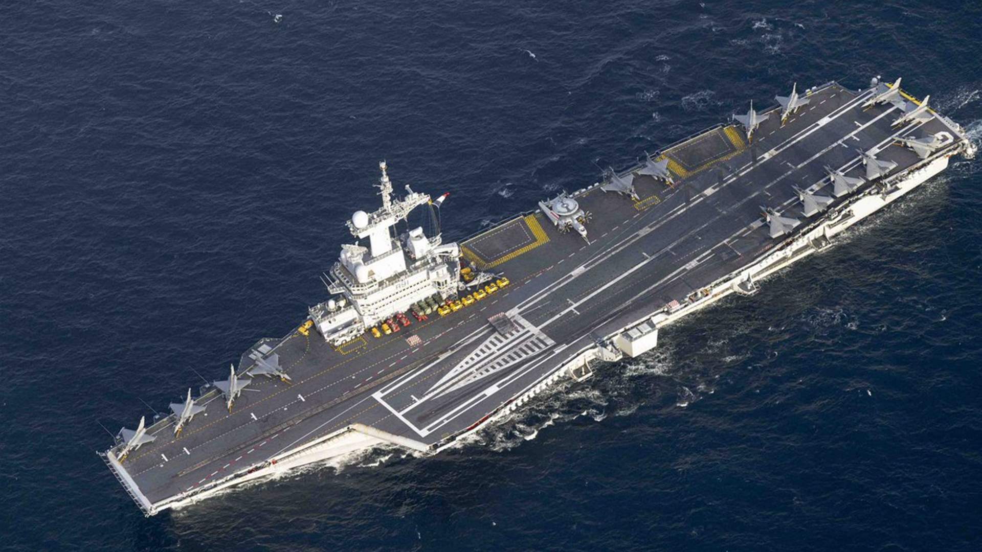 France sending aircraft carrier to Mediterranean, says Macron