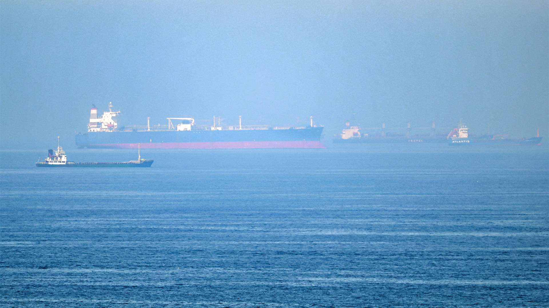 Iran state media says four projectiles hit areas east of Hormuz Strait