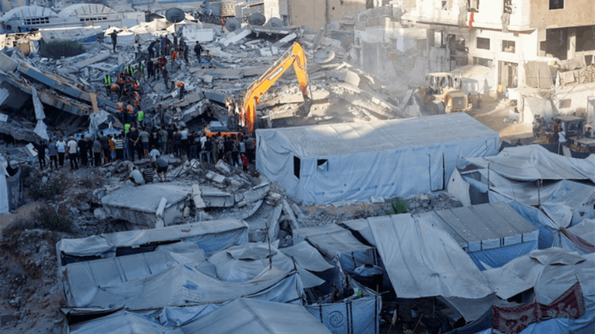 Gaza civil defense says toll from building collapse rises to 20, including five children