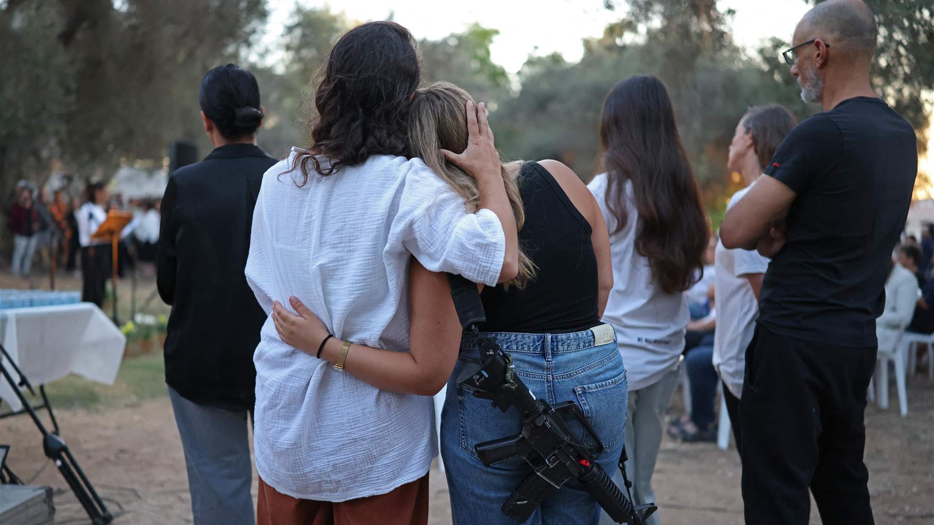 Mourners observe moment of silence to mark October 7 attack on Israel