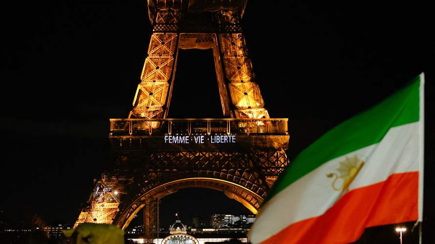Paris' Eiffel Tower lights up with slogans in solidarity with Iranians